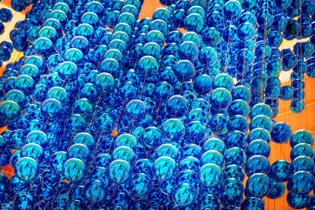 A multitude of transparent blue spheres, creating a textured, abstract pattern.